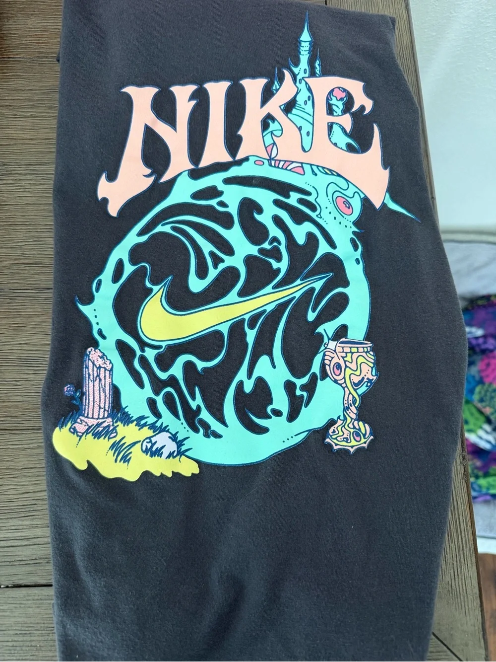 Nike Black Tee with Teal, Yellow & Peach Graphic